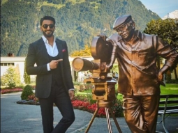 Ranveer Singh poses alongside Yash Chopra’s statute in Switzerland