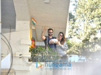 Saif Ali Khan and Kareena Kapoor Khan pose with baby Taimur outside their residence