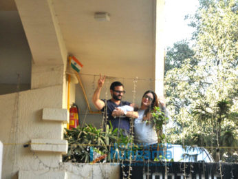 Saif Ali Khan and Kareena Kapoor Khan pose with baby Taimur outside their residence