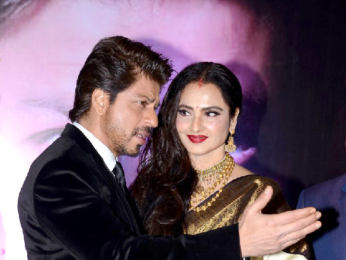 Rekha presents Shah Rukh Khan with the 4th Yash Chopra Memorial award