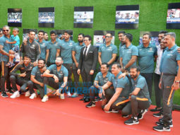 Anushka Sharma and cricketer Virat Kohli pose with Sachin Tendulkar at the premiere of Sachin: A Billion Dreams