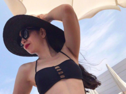Karisma Kapoor looks smoking hot in this black two-piece swimwear and we can’t stop ogling