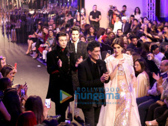 Sidharth Malhotra, Kriti Sanon and Karan Johar walk the ramp for Manish Malhotra's Design One show in Dubai