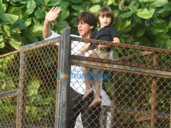 Shah Rukh Khan and Abram snapped waving and wishing fans Eid Mubarak at Mannat