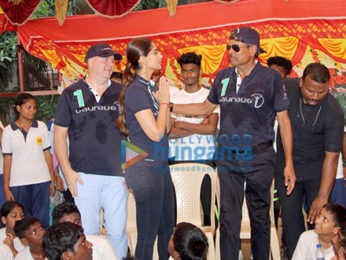 Sonam Kapoor and Kapil Dev at an event held by Magic Bus in Dharavi