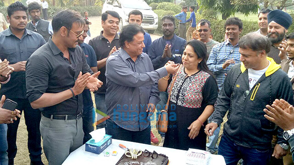 ajay devgn celebrates producer kumar mangat pathaks birthday on the sets of raid 1