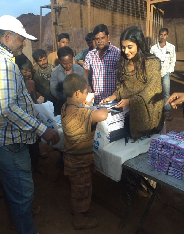 Check out Pooja Hegde distributes books to 100 kids on the sets of her next Telugu film!