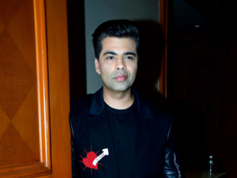 Karan Johar snapped at press meet for Ishq FM
