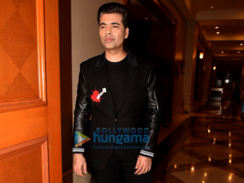 Karan Johar snapped at press meet for Ishq FM