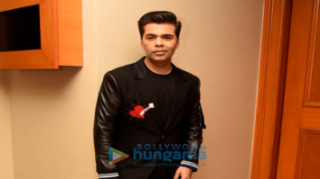 Karan Johar snapped at press meet for Ishq FM