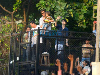 Shah Rukh Khan waves to fans from Mannat on his 52nd birthday