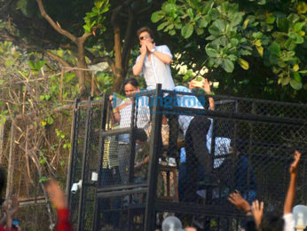 Shah Rukh Khan waves to fans from Mannat on his 52nd birthday