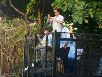 Shah Rukh Khan waves to fans from Mannat on his 52nd birthday
