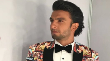 Lights, Camera, Action – Ranveer Singh wears some good old filmy nostalgia on his fashionable sleeve for the 63rd Jio Filmfare Awards 2018!