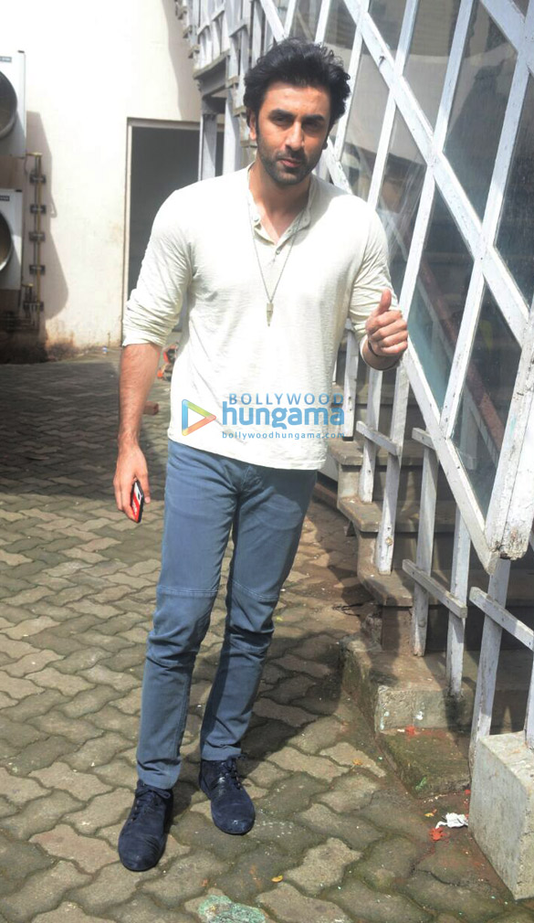 Ranbir Kapoor poses for paps in a white shirt and denims - Bollywood Hungama