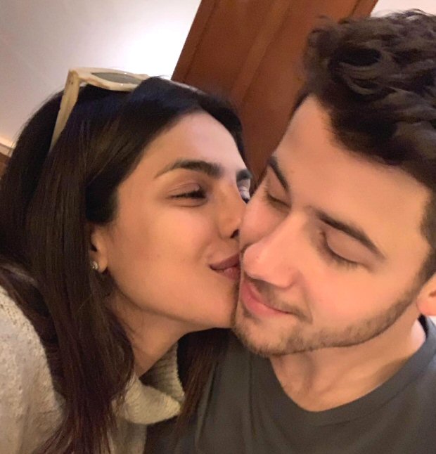 Priyanka Chopra gives a sweet kiss to hubby Nick Jonas as he surpasses The Rock to win GQ's Most Stylish Man of 2018