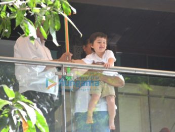 Taimur Ali Khan spotted playing Holi in his balcony