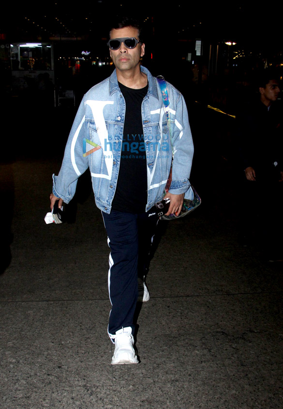 sonam kapoor ahuja anand ahuja and karan johar snapped at the airport 4