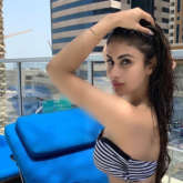 HOTNESS! Mouni Roy soars temperature as she sizzles in a striped bikini