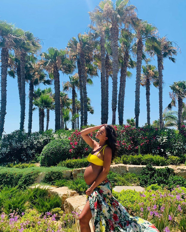 HOT! Amy Jackson looks radiant in yellow bralet as she flaunts her pregnancy glow during her latest exotic vacation
