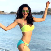 Karishma Tanna gets her beach mode on and rocks in a fluorescent bikini
