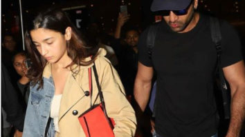 Ranbir Kapoor safely escorts Alia Bhatt from the crowd gathered at the airport