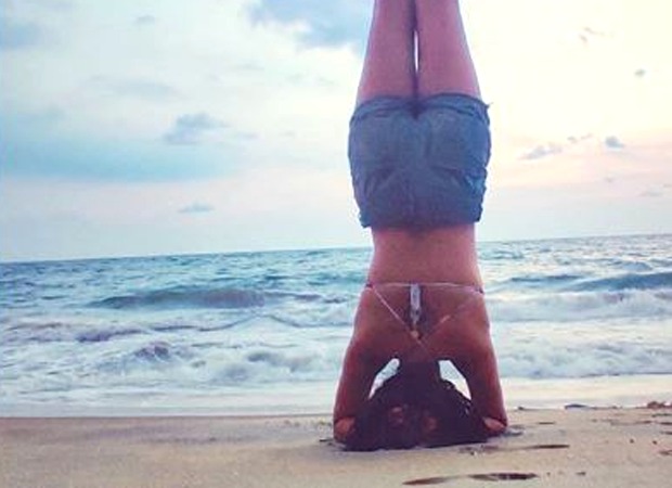 Amala Paul shares pictures of her headstand pose by the beach; calls it a new start