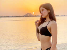 Sakshi Mallik flaunts her enviable curves in a black bikini as she poses in the backdrop of a sunset