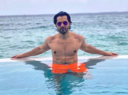 Varun Dhawan is chilling in the pool in Maldives flaunting his ab-tastic physique