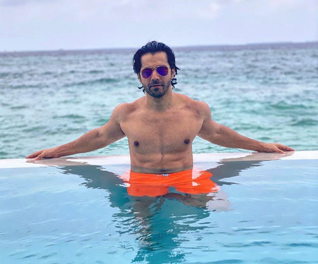 Varun Dhawan is chilling in the pool in Maldives flaunting his ab-tastic physique 