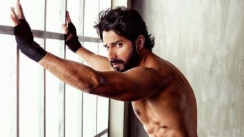 HAWT! Varun Dhawan flaunts his chiseled abs with an intense expression as he poses shirtless
