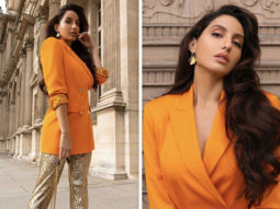 Nora Fatehi pairs orange Versace blazer worth 1.2 lakhs with shimmery pants and YSL bag worth Rs. 1.5 lakhs