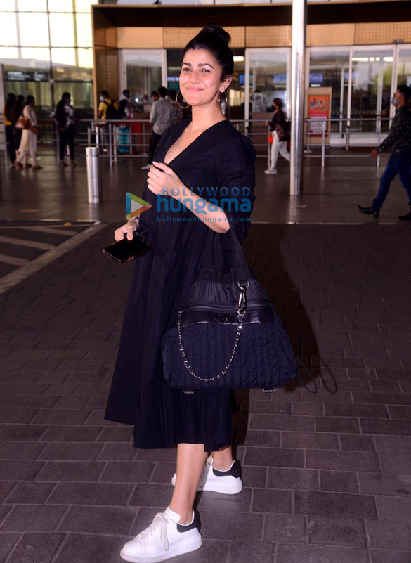 photos nimrat kaur poonam pandey and anu malik snapped at the airport 1