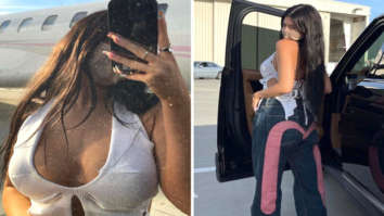 Kylie Jenner pairs plunging neckline crop top with printed wide leg pants Kylie Jenner pairs plunging neckline crop top with printed wide leg pants