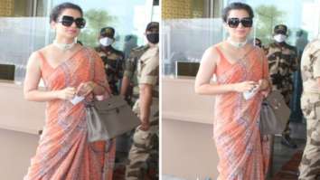 Kangana Ranaut leaves for Manali after testing negative for COVID-19; dons orange saree at the airport