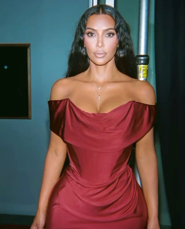 Kim Kardashian serves looks in sexy pictures in an off-shoulder satin bodycon gown by Vivienne Westwood