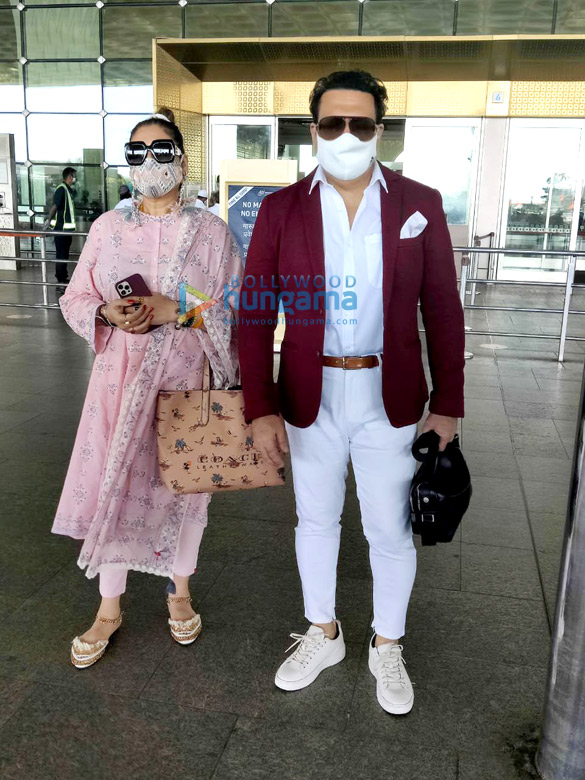 Photos: Govinda and wife Sunita Ahuja snapped at the airport Photos: Govinda and wife Sunita Ahuja snapped at the airport