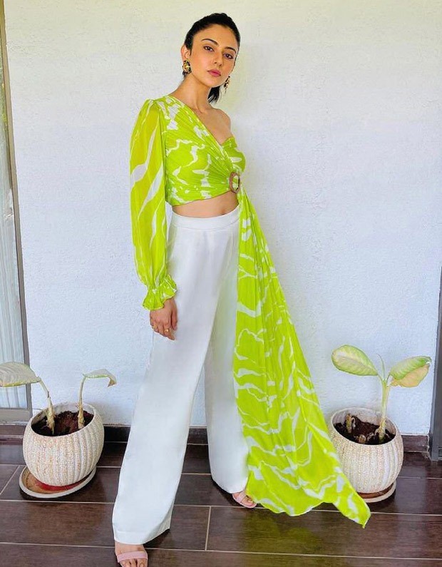 Rakul Preet Singh's one-shoulder crop top and flared white pants are comfy summer outfit Rakul Preet Singh's one-shoulder crop top and flared white pants are comfy summer outfit