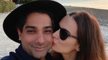 Evelyn Sharma gives a sweet kiss to her husband Tushaan Bhindi whilst on their honeymoon