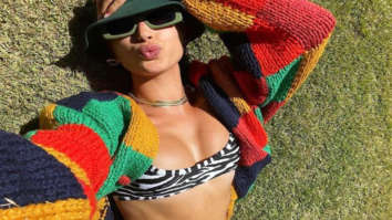 Hailey Bieber stuns on her vacation; soaks in the sun donning black and white print bikini with a cover up