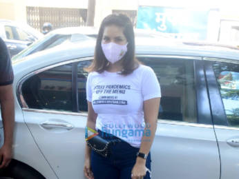 Sunny Leone and Daniel Weber snapped distributing food at Earth cafe in Bandra