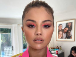 Selena Gomez makes a case for green manicure and neon coral eye makeup echoing the tropical weather