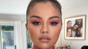 Selena Gomez makes a case for green manicure and neon coral eye makeup echoing the tropical weather