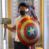 Shang-Chi’s Simu Liu strikes a pose with Captain America’s Shield & Thor's Mjolnir at Marvel headquarters