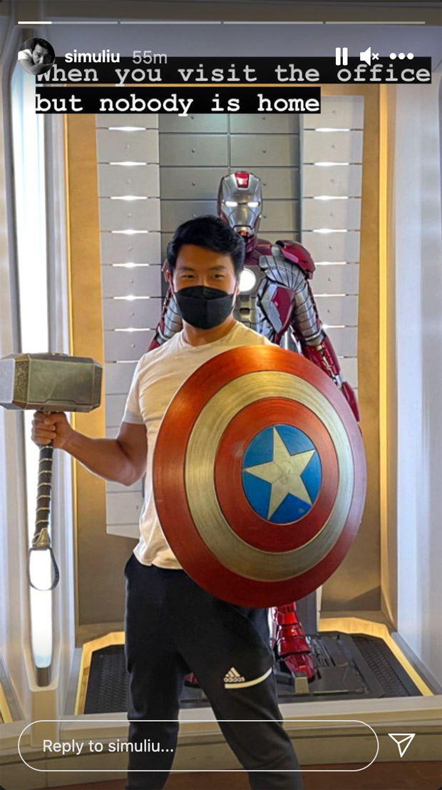 Shang-Chi’s Simu Liu strikes a pose with Captain America’s Shield & Thor's Mjolnir at Marvel headquarters 