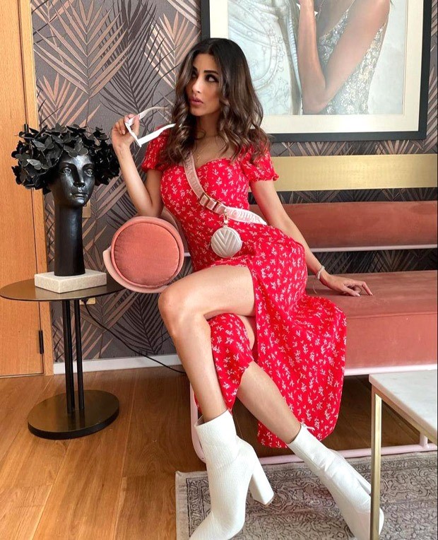 Mouni Roy pairs a red thigh-high slit midi dress with Louis Vuitton mini cross body bag worth Rs. 2.37 lakh