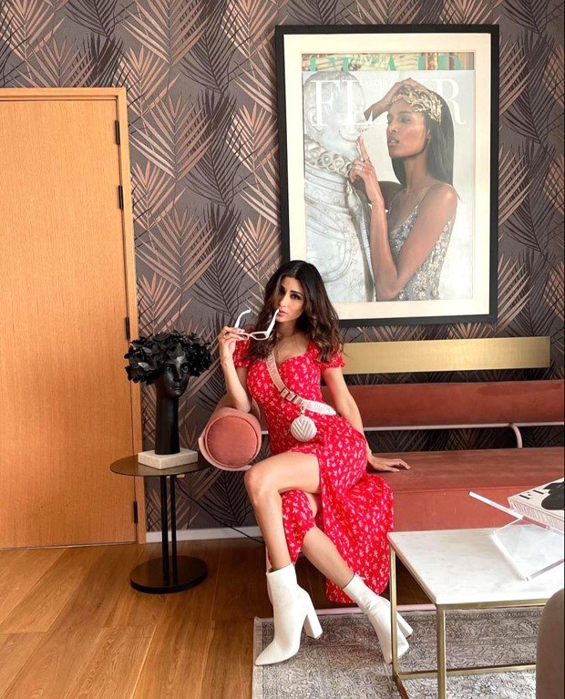 Mouni Roy pairs a red thigh-high slit midi dress with Louis Vuitton mini cross body bag worth Rs. 2.37 lakh