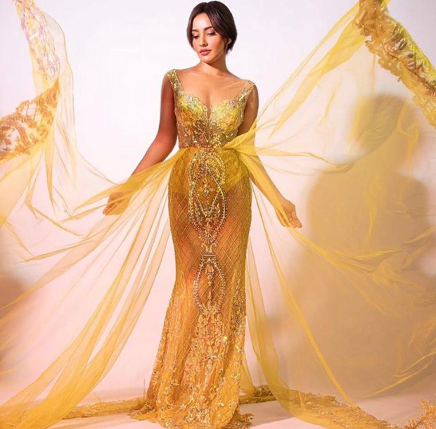 Neha Sharma looks opulent in yellow embellished semi-sheer gown with long trail