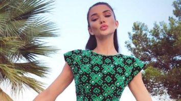 Amy Jackson is a diva in a short dress as she flaunts her long legs in a risqué slit high up the thigh