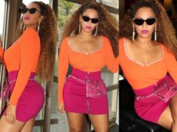 Beyoncé gives major colour blocking lessons as she pairs a tangerine top with a hot pink skirt
